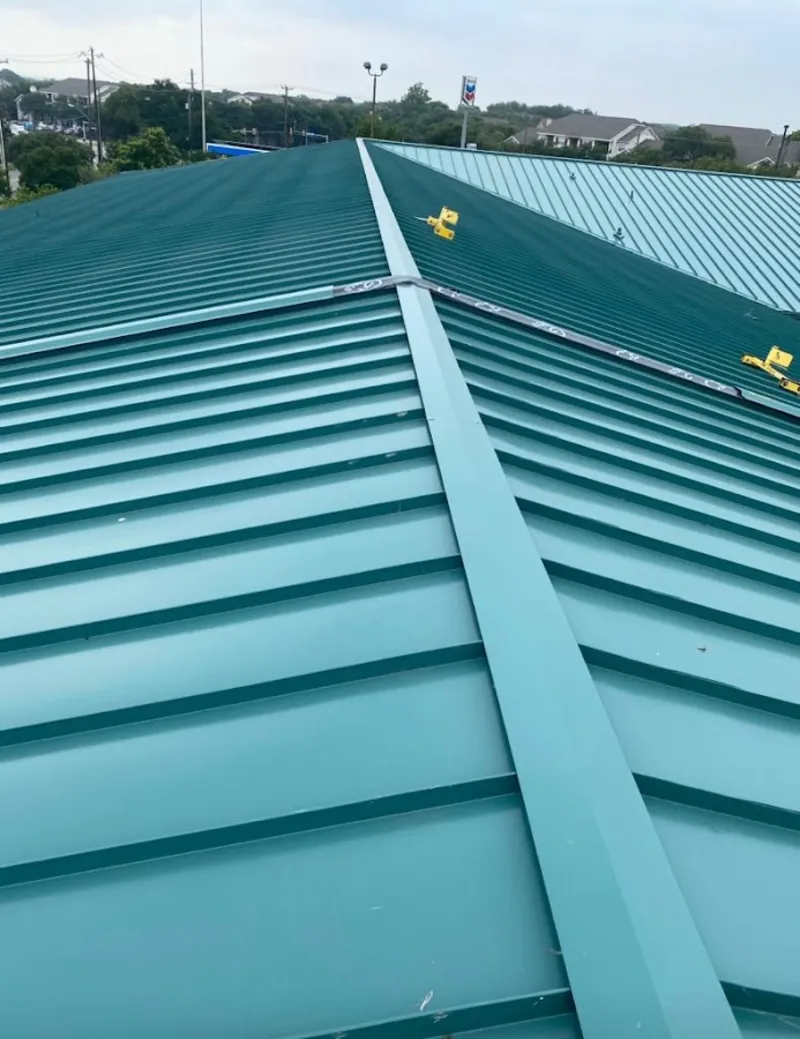 Green commercial metal roof ridge and valley for Metal Roof Repair in Wayland