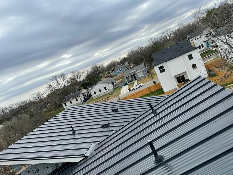 Standing seam metal roof panels with vents for Skylight Repair in Wayland